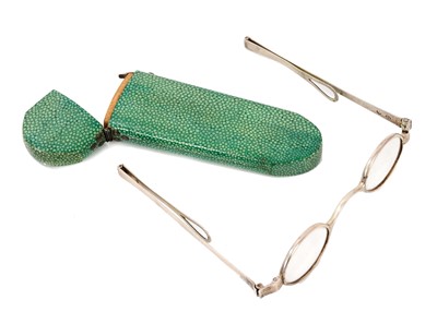 Lot 860 - Pair of George III silver framed spectacles in a green shagreen spectacle case