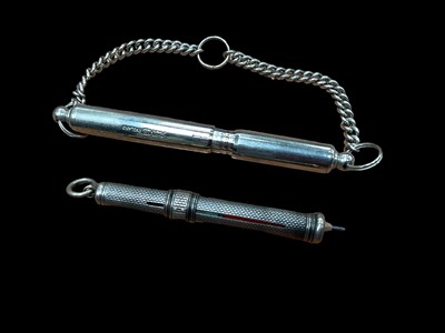 Lot 2581 - Early 20th century white metal propelling pencil by S. Mordan & Co, together with an ACME whistle, stamped Pat. No. 486417 (2)