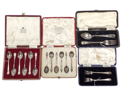 Lot 268 - Set of six Elizabeth II silver tea spoons in a fitted case, (Sheffield 1962), together with another cased set of six silver spoons, cased set of silver pickle forks and a cased silver spoon and for...