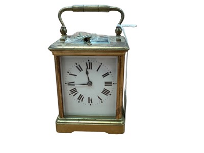 Lot 2583 - Old brass repeating carriage clock striking on gong with key 16cm