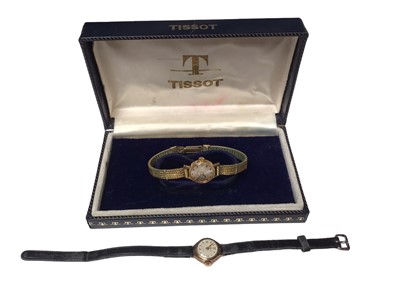 Lot 252 - Tissot 18ct gold cased ladies wristwatch on plated bracelet, boxed, together with a 9ct gold cased ladies wristwatch on leather strap (2)
