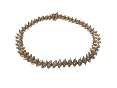 Lot 318 - Diamond bracelet with a line of single cut diamonds in a leaf design in 9ct gold setting
