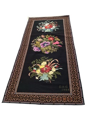 Lot 2047 - 1934 hand-embroidered wool cross stitch tapestry panel, flowers on black ground, signed E H G 1934
