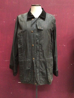 Lot 2048 - Women's navy wax jacket with tartan lining from the Formoy Collection made in Ireland size SX plus two waxed cotton Hats with tartan bands and lining, size M.