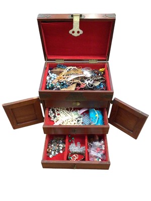 Lot 280 - Chinese hardwood and brass bound jewellery cabinet containing a collection of vintage costume jewellery together with another jewellery box of costume jewellery