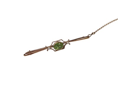 Lot 307 - Edwardian 15ct gold peridot and seed pearl bar brooch