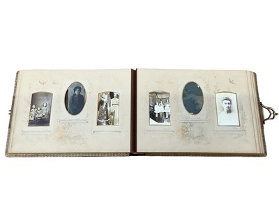 Lot 1542 - Three embossed Victorian photograph albums containing family and other carte de visite cards and photos