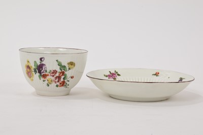 Lot 67 - Derby ribbed tea bowl and saucer, painted with flowers, circa 1758