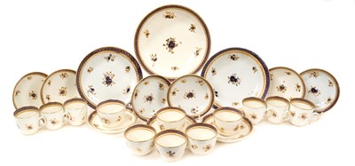 Lot 103 - Caughley blue and gilt part service