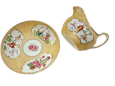 Lot 170 - Wedgwood bone china milk jug and saucer dish, printed and painted with Chinese figures