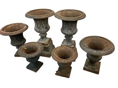 Lot 1456 - Six antique cast iron garden urns of campana form