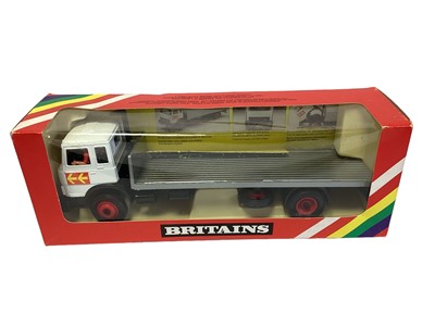 Lot 208 - Britains Iveco Flatbed Transporter No.9582, Massey Ferguson 595 red & silver livery Tractor with bale fork No.9595, Rotary Tedder No.9541 & Chafer Sprayer No.9567, in window boxes (4)