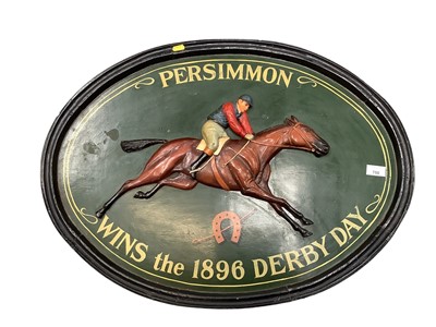 Lot 750 - Painted woooden oval plaque depicting a jockey on a racehorse 'Persimmon wins the 1896 Derby Day'