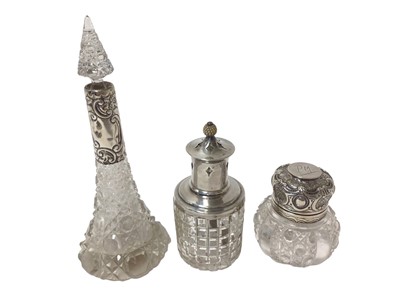 Lot 372 - Two silver mounted scent bottles, together with a silver table top incense burner (3)