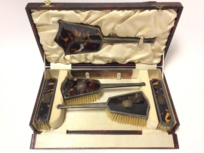 Lot 373 - 1930s silver and tortoiseshell dressing table brush and mirror set in fitted case