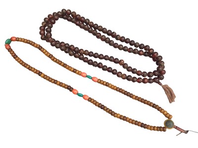 Lot 1030 - Two large Tibetan simulated and reconstituted amber prayer bead necklaces