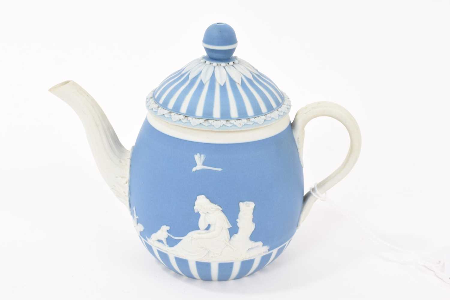 Lot 194 - Wedgwood blue jasper dip solitaire teapot and cover, applied with ‘Lady Templeton’s Domestic Employment’ and ‘Poor Maria’, circa 1785