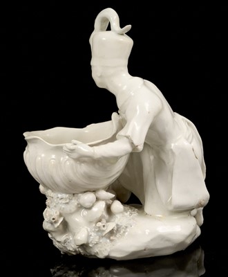 Lot 219 - Bow sweetmeat figure, in the white, of a man in Turkish costume, after a Meissen original, circa 1755