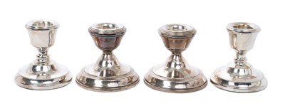 Lot 402 - Two pairs of contemporary silver dwarf candlesticks