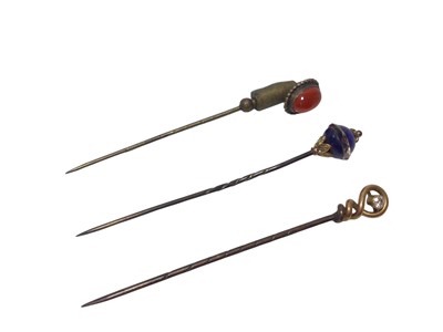 Lot 583 - Three stick pins