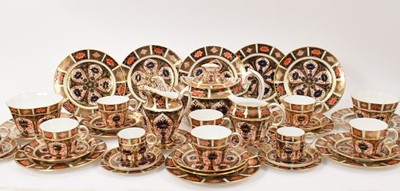 Lot 240 - Royal Crown Derby Imari pattern 1128 tea and coffee service, to include a teapot, milk jug, cream jug, two sugar bowls, six coffee cups with saucers and side plates, and six tea cups with saucers a...