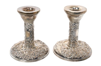 Lot 342 - Pair contemporary silver candlesticks, with embossed flora and fauna decoration