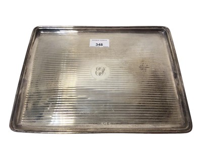 Lot 348 - George V silver dressing table tray of rectangular form, with raised border, engine turned decoration