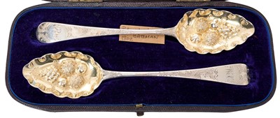 Lot 366 - Pair George III silver table spoons, later converted to berry spoons, with ornate fruit bowls