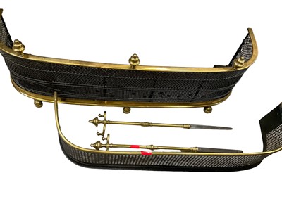 Lot 1388 - Two 19th century brass fenders and two pokers