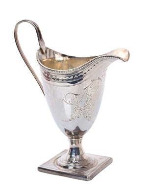 Lot 378 - George III silver cream jug of helmet form, with engraved decoration