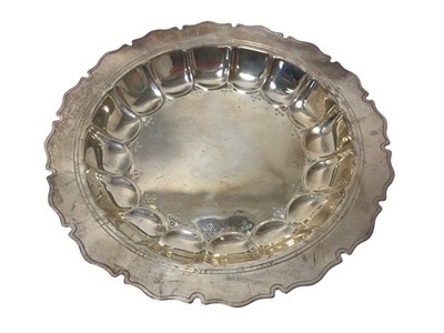 Lot 381 - 1920s Scottish silver dish of circular form with scalloped decoration and decorative border