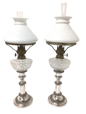 Lot 992 - Pair of Victorian plated telescopic peg lamps with shades
