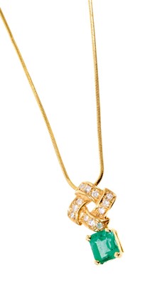 Lot 537 - Emerald and diamond pendant with a rectangular step cut emerald measuring approximately 6.4 x 5.7 x 4.7mm suspended from a diamond set stylized knot on an 14ct yellow gold chain