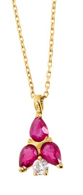 Lot 545 - Ruby and diamond pendant with a brilliant cut diamond and three pear cut rubies in 18ct gold setting on 18ct gold chain, 40cm.