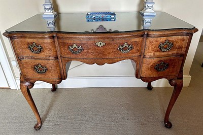 Lot 1495 - Queen Anne-style walnut dressing table by Waring & Gillows, with shaped serpentine top above an arrangement of five drawers, on cabriole legs, with plate glass top, 108cm wide x 55cm deep