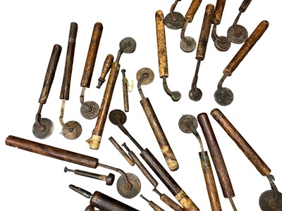 Lot 1532 - Set of 19th century leather working revolving stamps, designed for tooling leather furniture surfaces, approximately 23