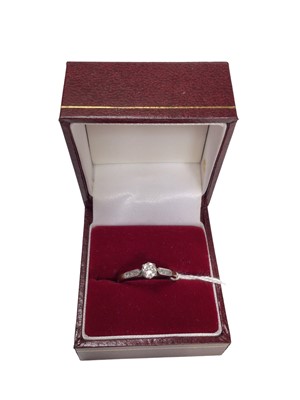 Lot 20 - Diamond single stone ring with further diamond set shoulders