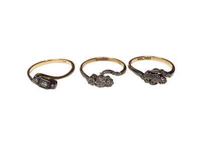 Lot 28 - Three 18ct gold diamond three stone rings in cross over settings