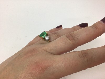 Lot 542 - Emerald and diamond three stone ring with a rectangular step cut emerald measuring approximately 8.3mm x 7mm x 5.8mm, flanked by two brilliant cut diamonds in claw setting on 18ct yellow gold shank...