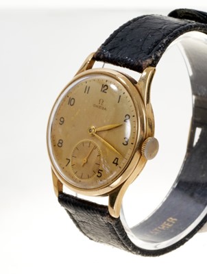 Lot 609 - 1940s gold Omega wristwatch