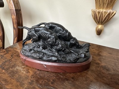 Lot 1524 - After Barye bronze group of two hunting dogs, raised on rouge marble plinth
