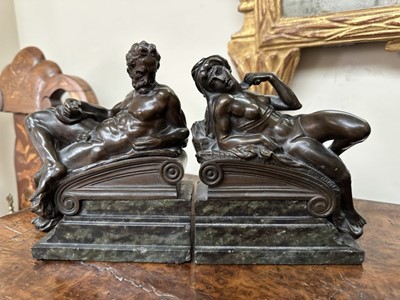 Lot 1527 - Pair of bronze bookends after Michaelangelo