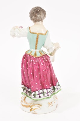 Lot 287 - Meissen figure of a young girl with flowers in her apron, circa 1880