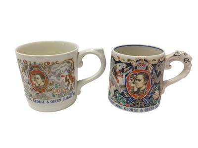 Lot 123 - Two Dame Laura Knight designed King George VI Coronation mugs 1937, 8-8.5cm high