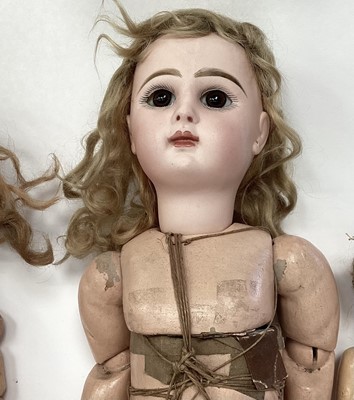 Lot 1955 - Three dolls French Tete Jumeau 8 bisque head, brown fixed eyes closed mouth, painted lips lashes and brows, blonde ringlets, composite body marked Jumeau Paris. S H 1079 DEP & bisque head doll with...
