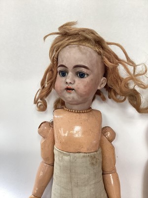 Lot 1955 - Three dolls French Tete Jumeau 8 bisque head, brown fixed eyes closed mouth, painted lips lashes and brows, blonde ringlets, composite body marked Jumeau Paris. S H 1079 DEP & bisque head doll with...