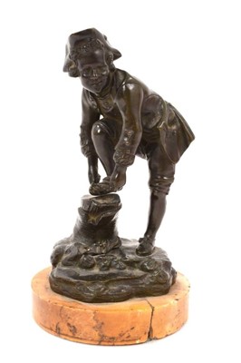 Lot 1121 - 19th century French bronze figure of a boy tying his ice skate