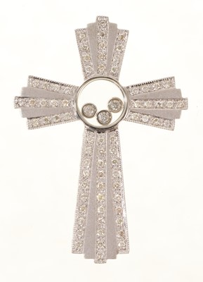 Lot 461 - Diamond cross pendant with floating diamonds in a central glazed compartment with further brilliant cu diamonds in 9ct white gold setting