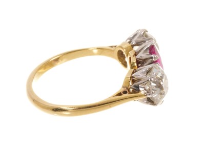 Lot 450 - Fine ruby and diamond three stone ring with an oval mixed cut ruby flanked by two old cut diamonds in platinum claw setting on 18ct gold shank