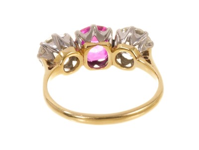 Lot 450 - Fine ruby and diamond three stone ring with an oval mixed cut ruby flanked by two old cut diamonds in platinum claw setting on 18ct gold shank